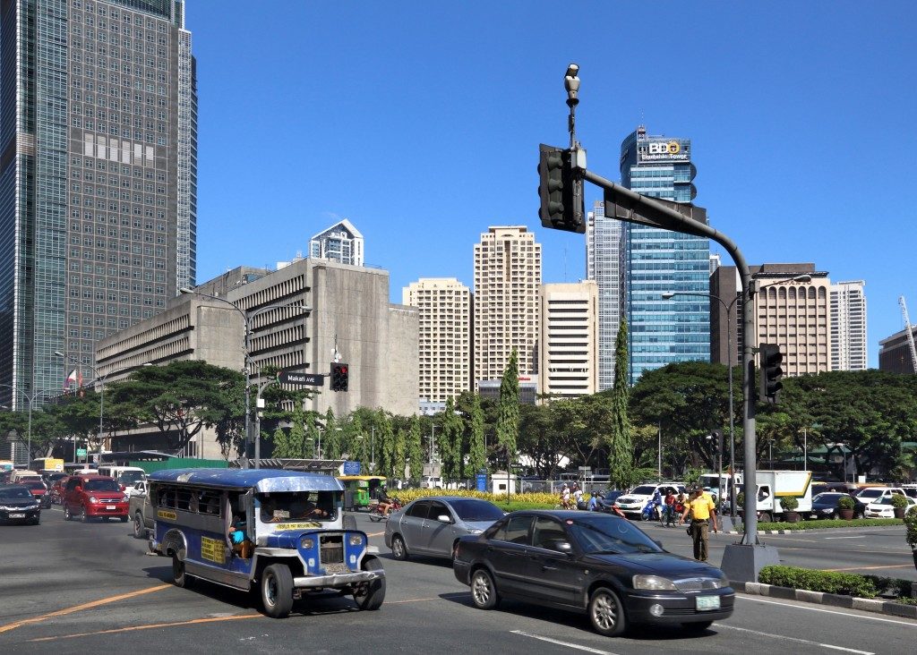 Cars and jeepney in makati