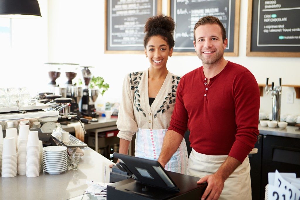 two people in front of the counter