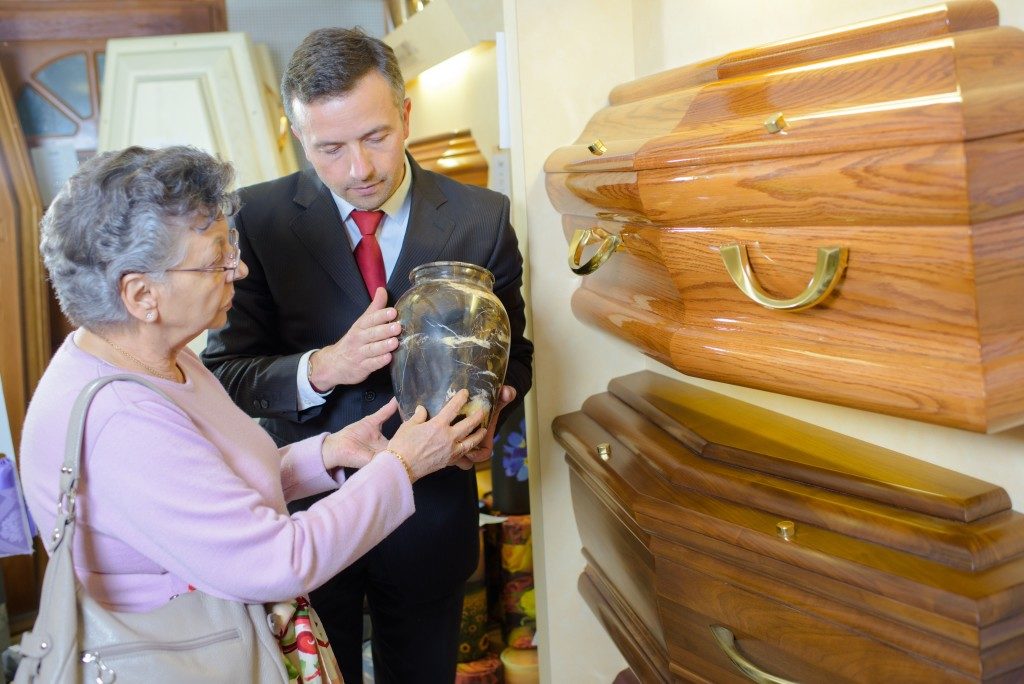old lady choosing a coffin