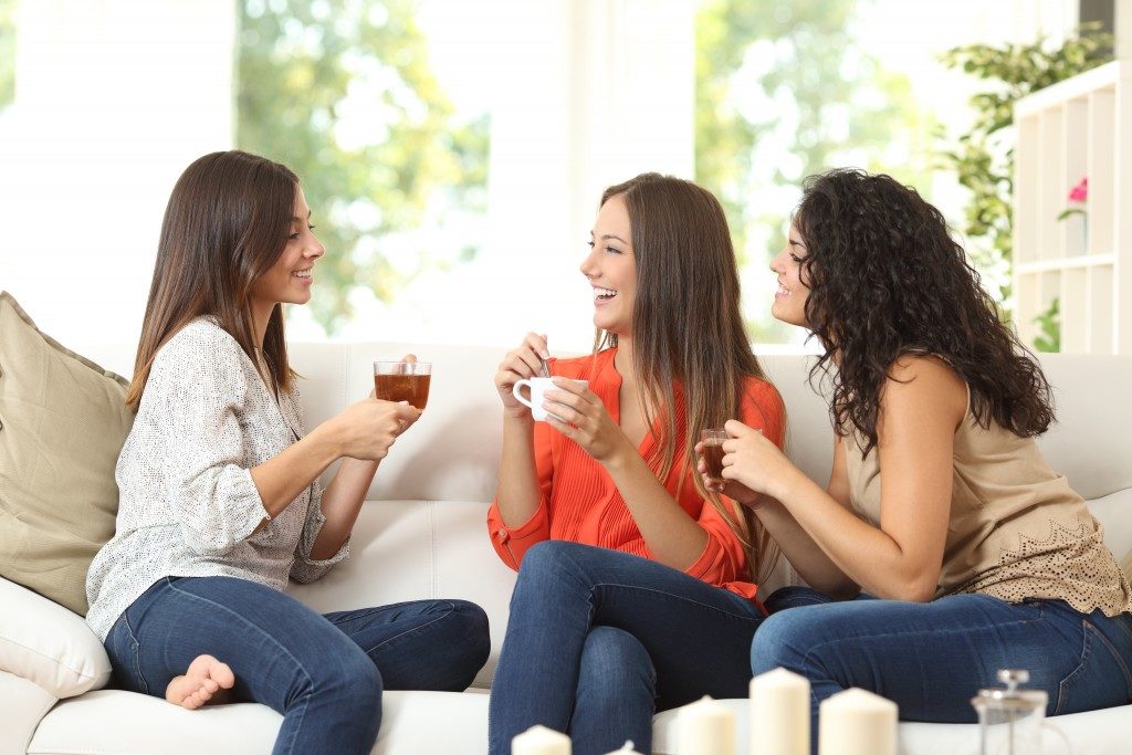friends having tea in the living room