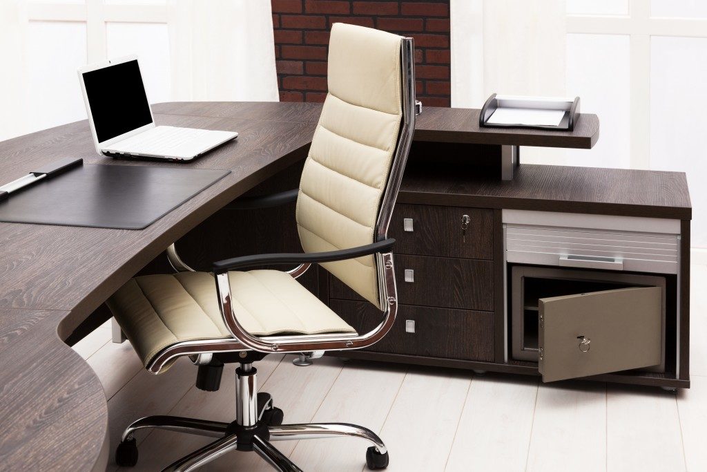 workplace with wooden desk and drawer