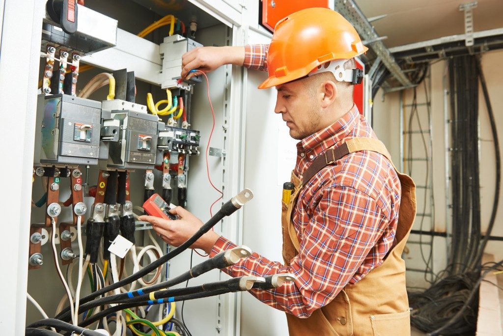 electrician using a switch board