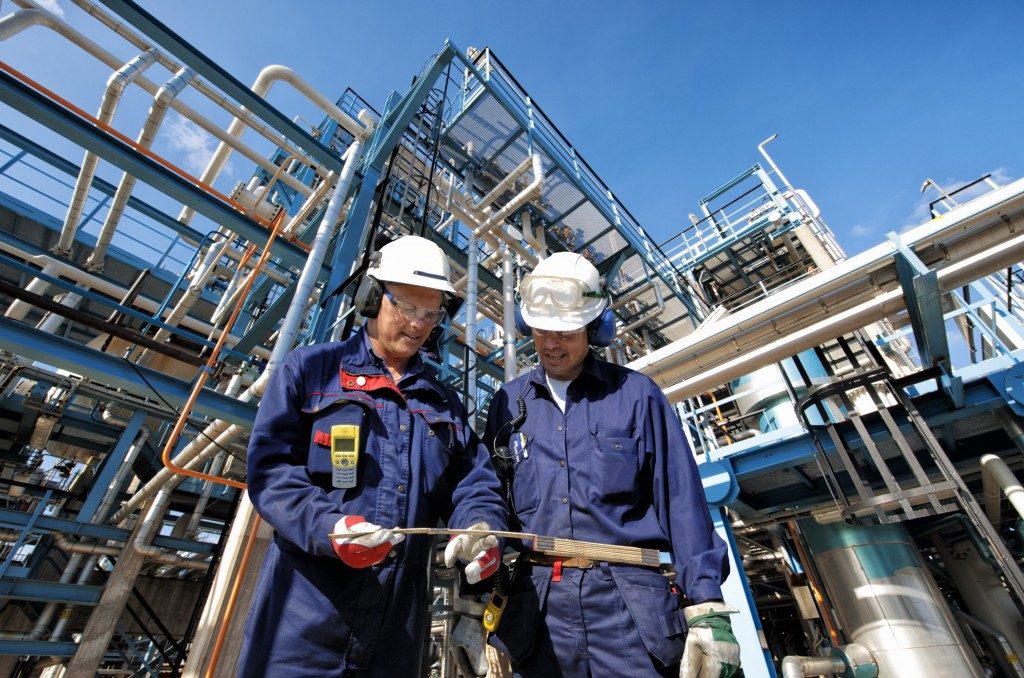 Two oil refinery workers