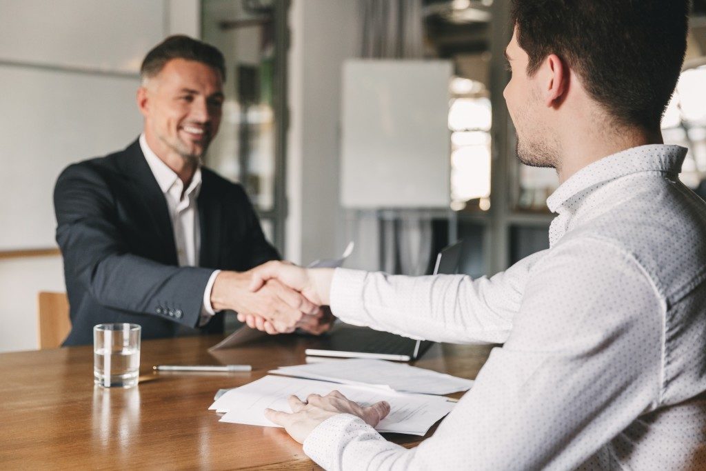 HR shaking hands with an applicant