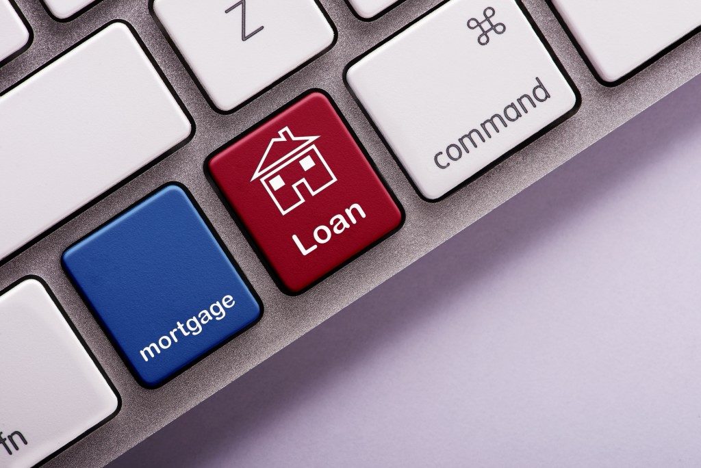 Mortgage loan button on computer keyboard