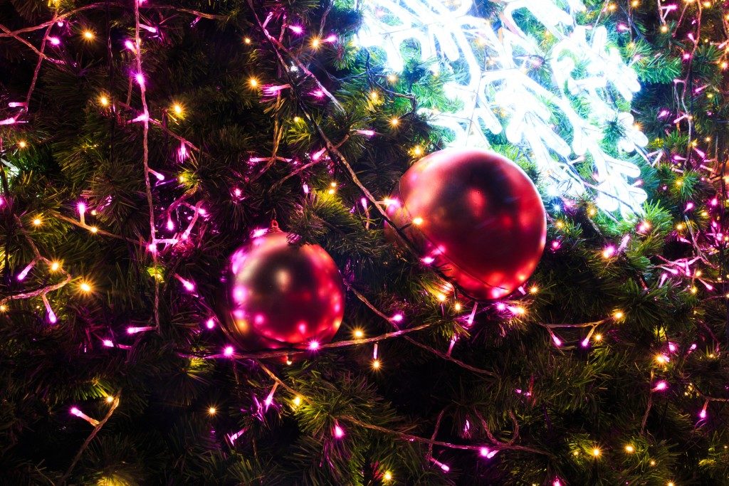 closeup of christmas lights and decor on a tree